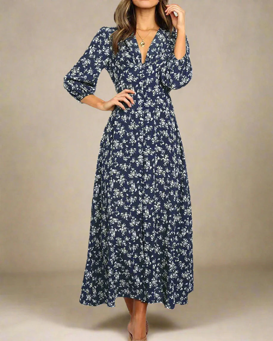 Woman wearing a navy floral dress on a white background