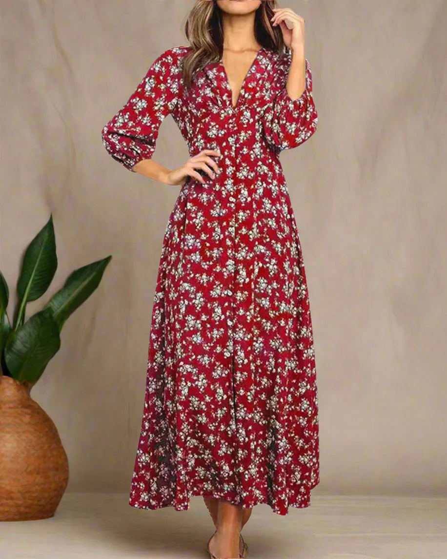 Red floral dress worn by a model on a white background