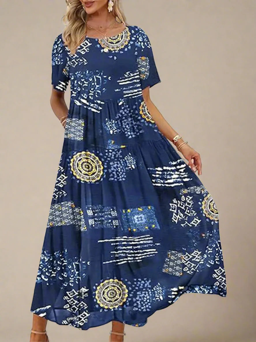 Woman wearing a blue dress with gold and white patterns on a white background